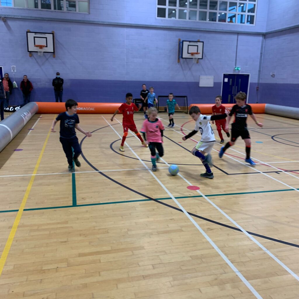Children celebrating at a Foot-Tech football party